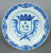 An 18th century blue and white Delft plate
The hatched and scroll decorated border centred with a