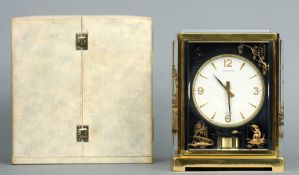 A Jaeger-LeCoultre Atmos clock
The bevelled four glass body with chinoiserie decorated panels and