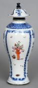 An 18th century Chinese baluster vase and cover
With a dog-of-fo finial above the blue and white