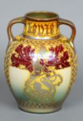 A Pilkingtons Royal Lancastrian lustre glazed vase by Gordon Forsyth
The short neck issuing twin