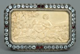 A 19th century Continental ivory and paste inset unmarked white metal snuff box
The hinged canted