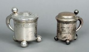 Two 19th century Continental silver tankards
One with embossed decoration and inset coin to lid,