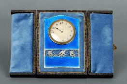 An early 20th century Continental unmarked white metal enamel decorated travelling strut clock
The