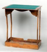 A 19th century Anglo-Indian hardwood campaign card table
The brass mounted hinged top enclosing a