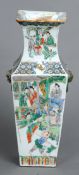 A 19th century Chinese porcelain famille verte vase
Of tapering square section form with twin dog-