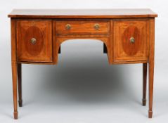 A 19th century mahogany bow front sideboard
The crossbanded top above two line inlaid drawers and