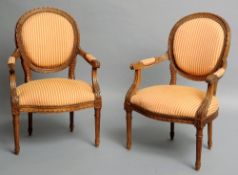 A pair of late 19th century French walnut open armchairs
The circular back issuing twin acanthus