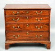 A George III mahogany chest of drawers
The moulded rectangular top above an arrangement of four