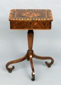 A 19th century marquetry inlaid rosewood work table
The geometrically inlaid hinged top enclosing