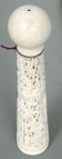 A 19th century Canton carved ivory Kendama game
The plain ivory ball above the handle carved in