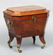 An early 19th century mahogany cellaret
The stepped canted rectangular top enclosing the lead