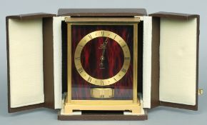 A Jaeger- LeCoultre Atmos clock
Of typical form with a brass chapter ring with Roman numerals,