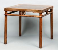 A Chinese elm centre table
The cleated top above a pierced frieze, standing on tubular legs.  87 cms