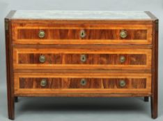 An 18th century Italian walnut and olive wood commode
The later fabric inset rectangular top above