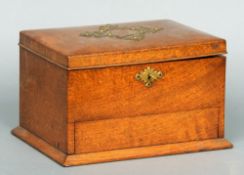 A Victorian oak humidor
The brass mounted hinged rectangular lid enclosing the twin division