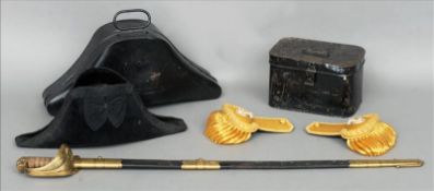 A 19th century Naval dress sword, a cased pair of epaulettes and a cased bicorn hat The sword with