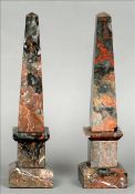 A pair of variegated marble obelisks Each of typical stepped form. 33.5 cms high. (2) Generally in