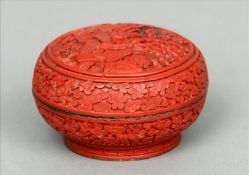 A late 19th century cinnabar lacquer bowl and cover The domed lid decorated with figures in a