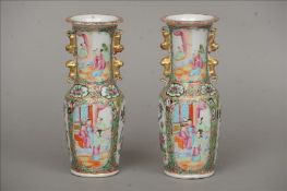 A pair of 19th century Canton famille rose vases Each flared neck rim above twin gilt decorated