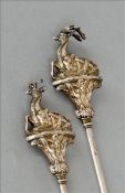 A pair of 19th century unmarked white metal meat skewers Each finial formed as a deer. Each 27 cms