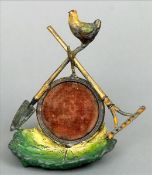 A 19th century cold painted watch holder The lettuce leaf form base surmounted with a roundel