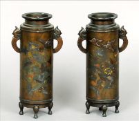 A pair of late 19th century Japanese bronze vases Each of cylindrical form with twin pierced