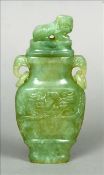 A Chinese carved jade vase and cover The removable lid surmounted with a dog-of-fo above elephant