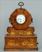 A 19th century inlaid rosewood mantel clock The octagonal clock with applied brass handles centred