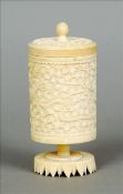 A 19th century Chinese ivory cannister and cover Of circular section and carved with dragons