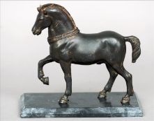 A 19th century bronze model of a horse Naturalistically modelled, standing on a black slate base. 18
