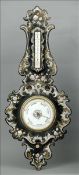 A large Victorian papier mache barometer Of scrolling banjo form, decorated throughout with mother-