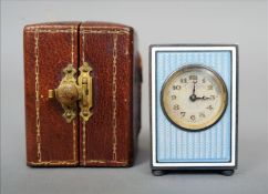 An early 20th century miniature enamelled clock The rectangular case with blue guilloche enamel