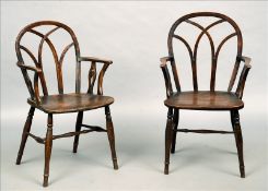 A pair of 19th century elm and beech Thames Valley Windsor chairs The arched Gothic style back