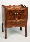 A 19th century mahogany tray top commode The galleried top with pierced carrying handles above two