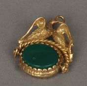 An unmarked gold fob seal Set with two doves below the suspension loop. 3 cms high. Some scuffing/