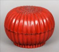 A Chinese cinnabar lacquer chrysanthemum box and cover Of lobed circular section, inscribed four