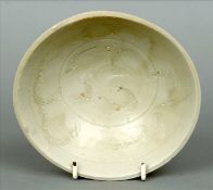 A Chinese Song dynasty provincial bowl The grey glaze with incised decoration. 15.5 cms diameter.