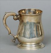 A Georgian silver tankard, possibly hallmarked London 1777, maker’s mark of WW The waisted