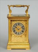 A 19th century French lacquered brass cased repeating carriage clock The scrolling handle above