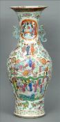 A 19th century Chinese polychrome porcelain twin handled vase Of baluster form with flared rim,