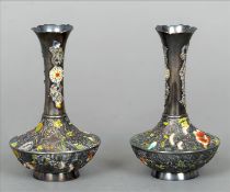 A pair of small enamel decorated Chinese silver vases Each with a slender flared neck and with