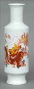 A Chinese white ground gu vase Of typical shape, decorated with a dragon and calligraphy, the
