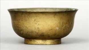 A 19th century Eastern silvered bronze bowl The flared rim above the plain body. 16 cms diameter.