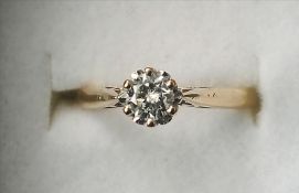 A 9 ct gold diamond solitaire ring The claw set stone spreading to approximately 0.25 carat.