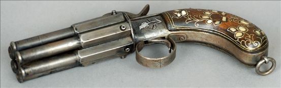 A 19th century Turkish six shot pepper box revolver The handle with brass and mother-of-pearl