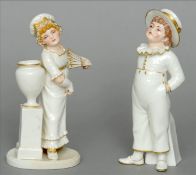 Two Royal Worcester James Hadley porcelain figures One a sugar shaker modelled as a young boy,