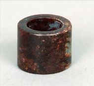 A Chinese hardstone archers ring Of typical plain cylindrical form. 2.75 cms high. Some slight