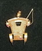 An unmarked 18 ct rose gold brooch Formed as a Hackney Carriage with coachman. 4.75 cms high.