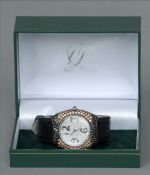 An 18 ct white gold diamond set gentleman’s wristwatch The bezel and face set with approximately 5