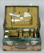 A Victorian leather gentleman’s travelling case The interior with various silver and other fitments,